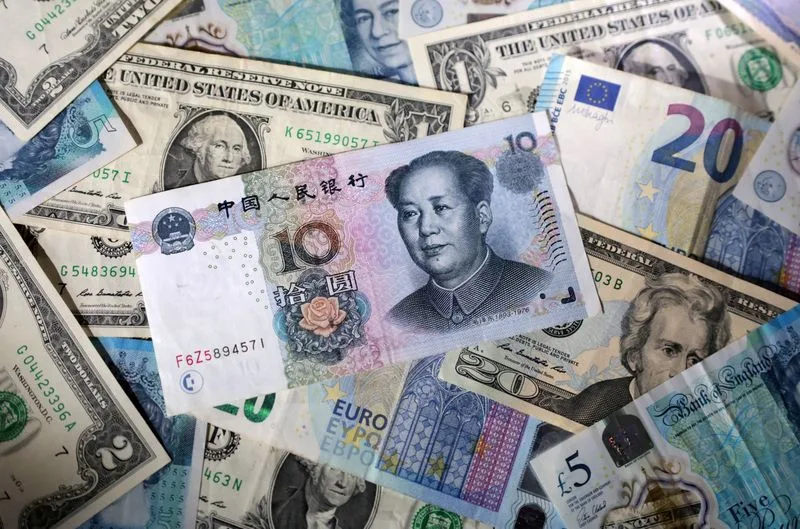 Đồng USD chạm đỉnh hai tuần khi thị trường chờ tín hiệu từ Fed và Mỹ - Trung - 1