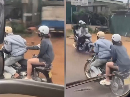 Giao thông - Clip: Thanh niên giận người yêu, ngồi tít đầu xe máy khiến dân mạng bật cười